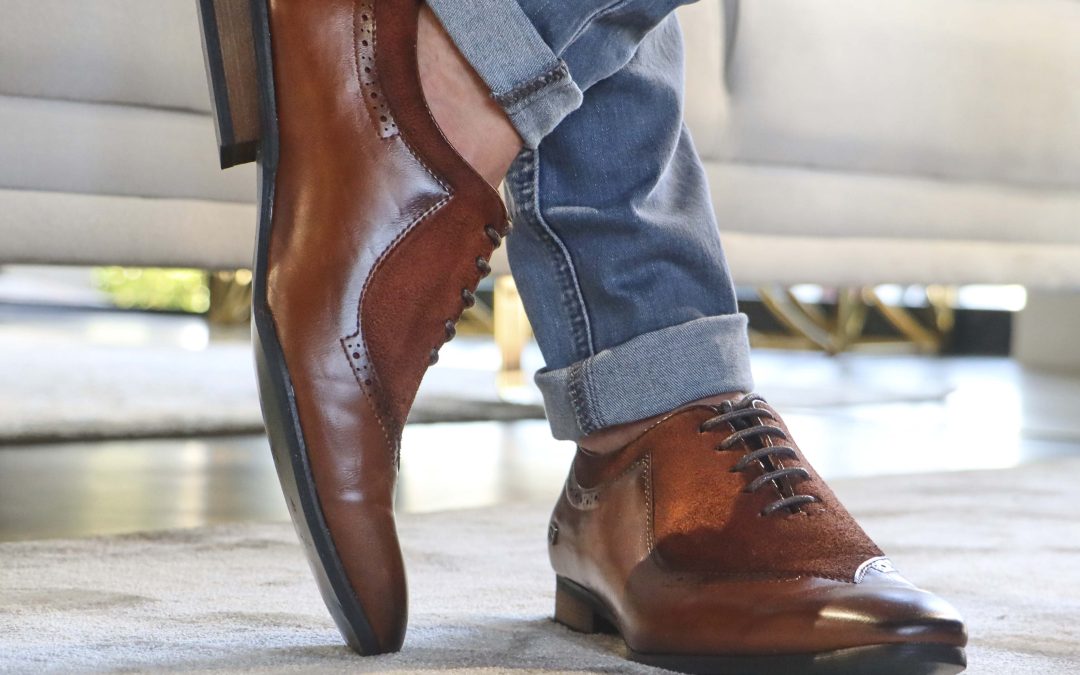 man wearing brown formal shoes
